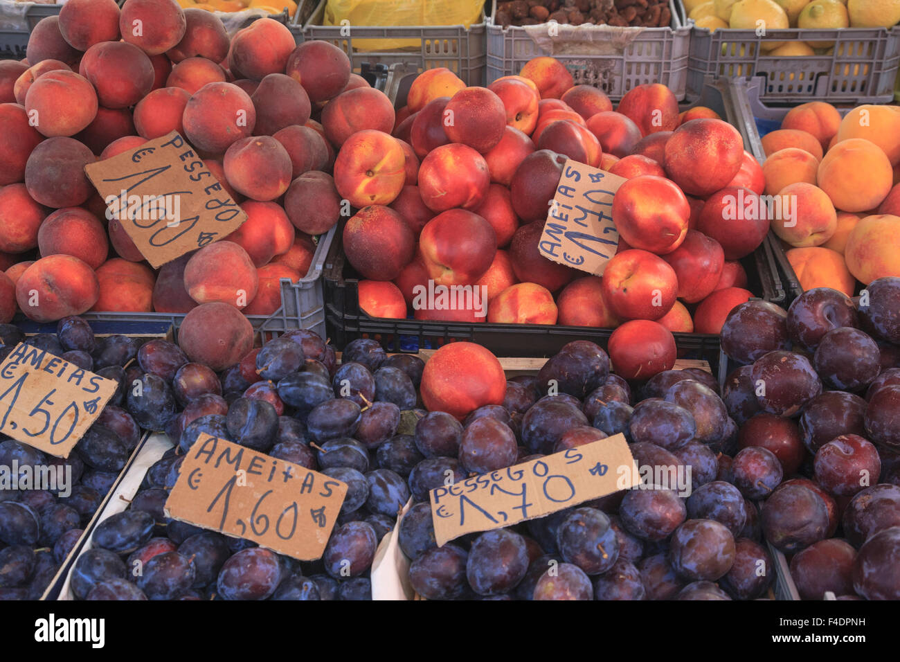 Fruits in baskets for sale at open air market in Portuguese town. Stock Photo