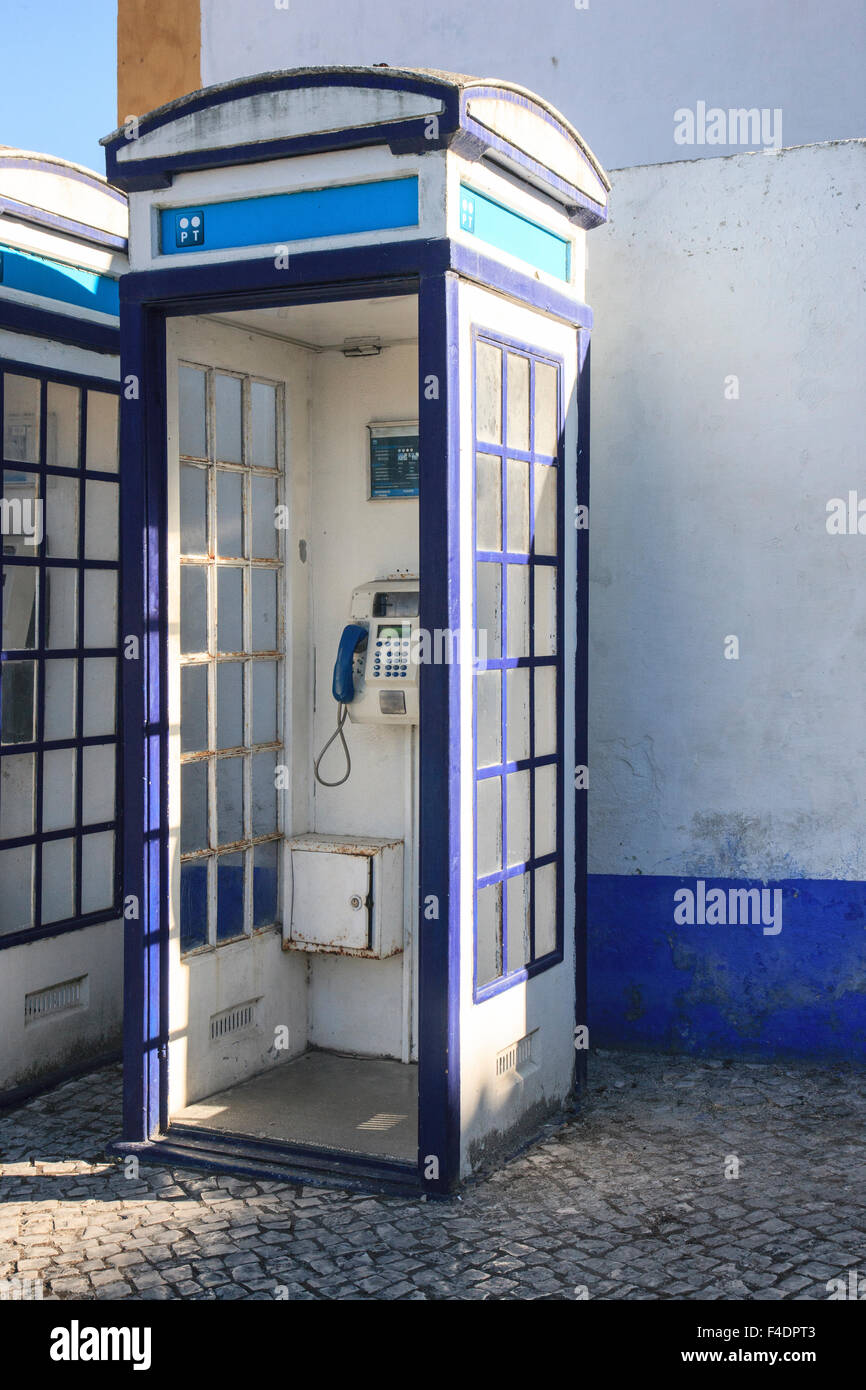 Old style phone booth still in use in Obidos, Portugal Stock Photo