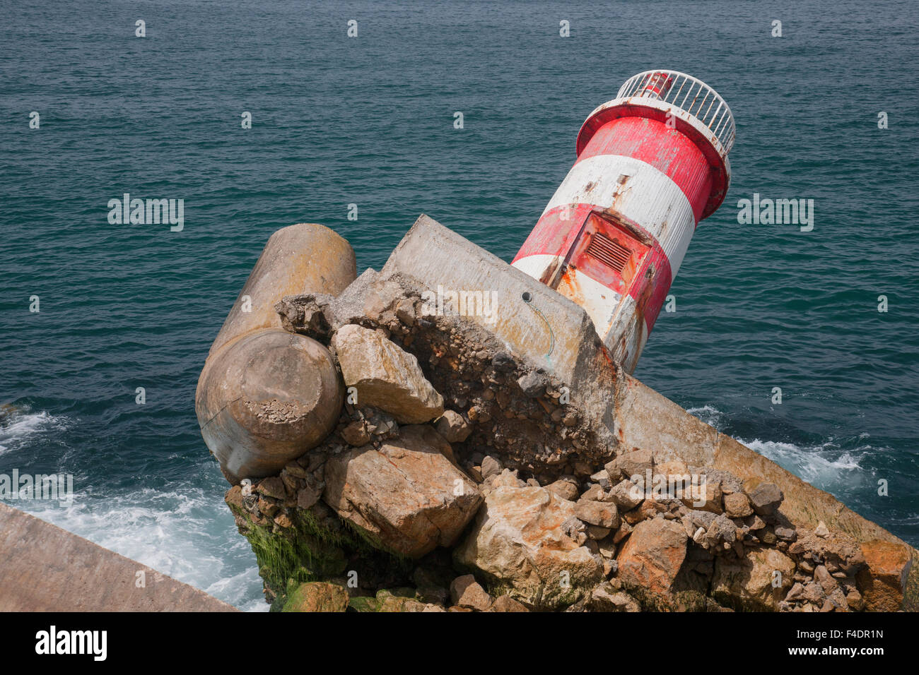 This is a lighthouse uprooted by weather on the shoreline of Nazare, Portugal Stock Photo