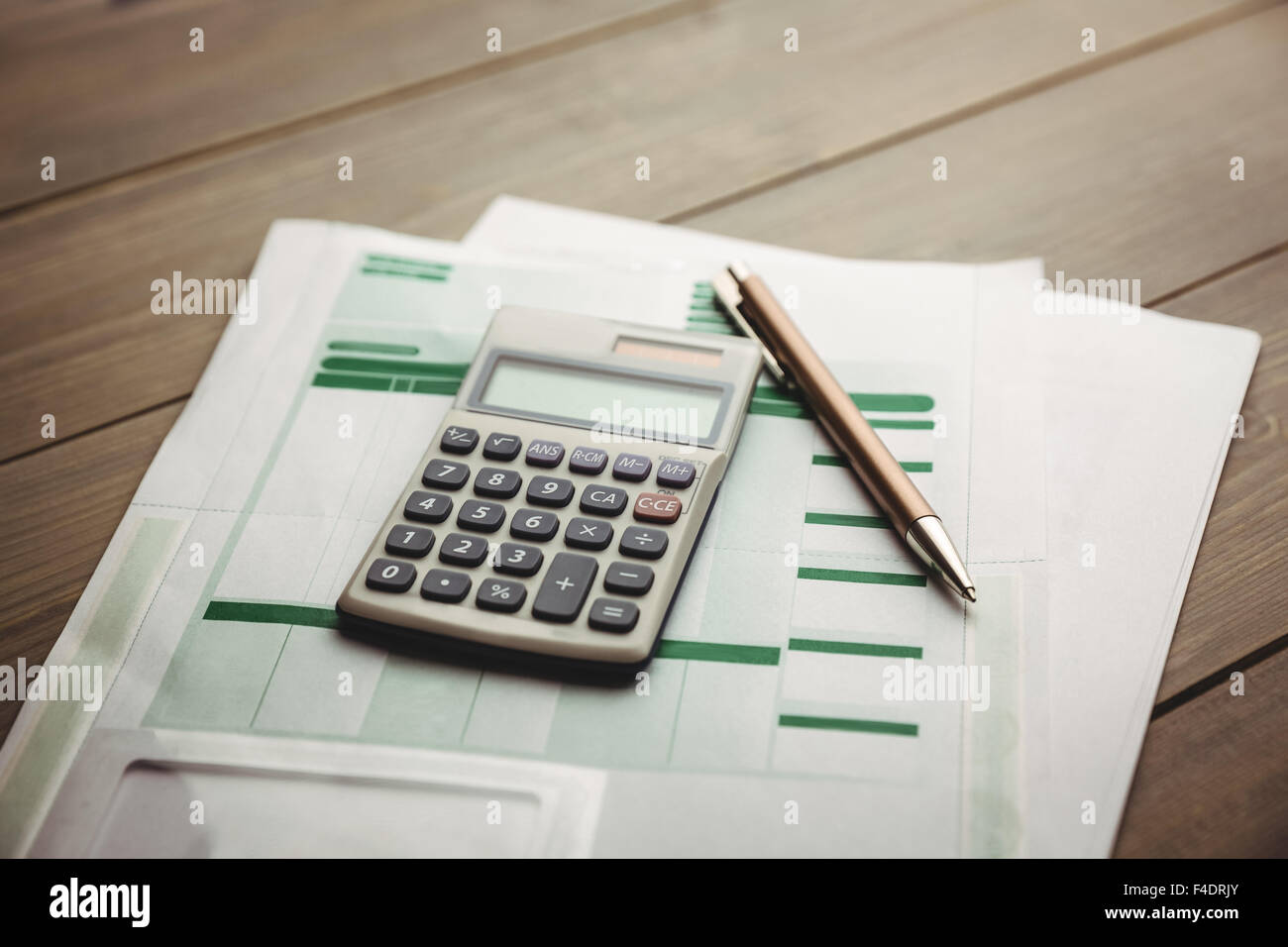 High angle view of calculator with documents on desk Stock Photo
