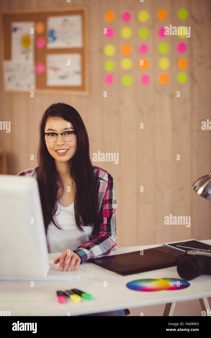 Young creating woman typing on keyboard Stock Photo