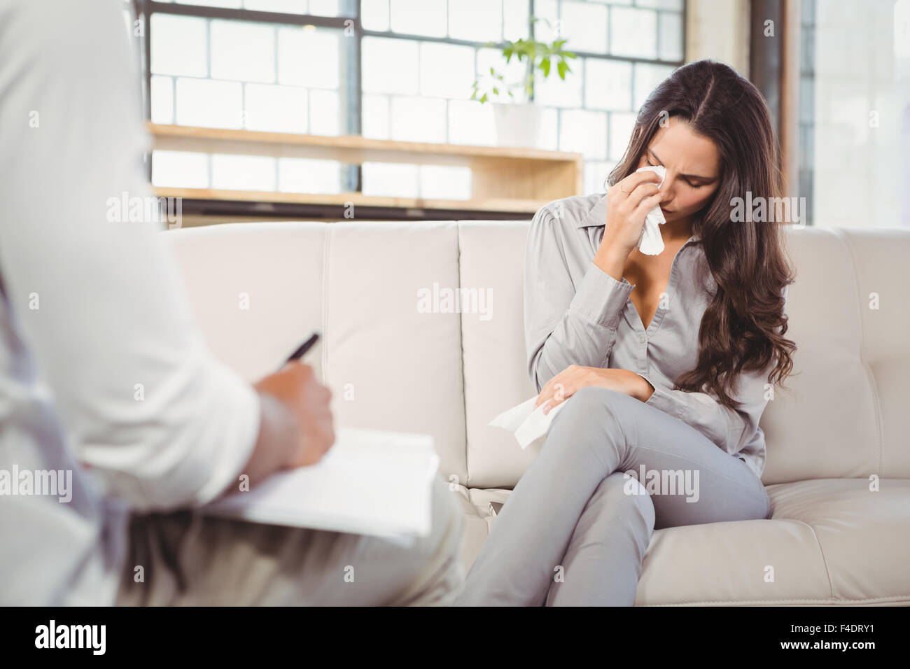 Female patient crying at clinic Stock Photo