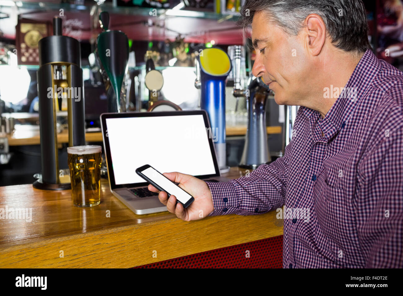 Man with grey hair workiing Stock Photo