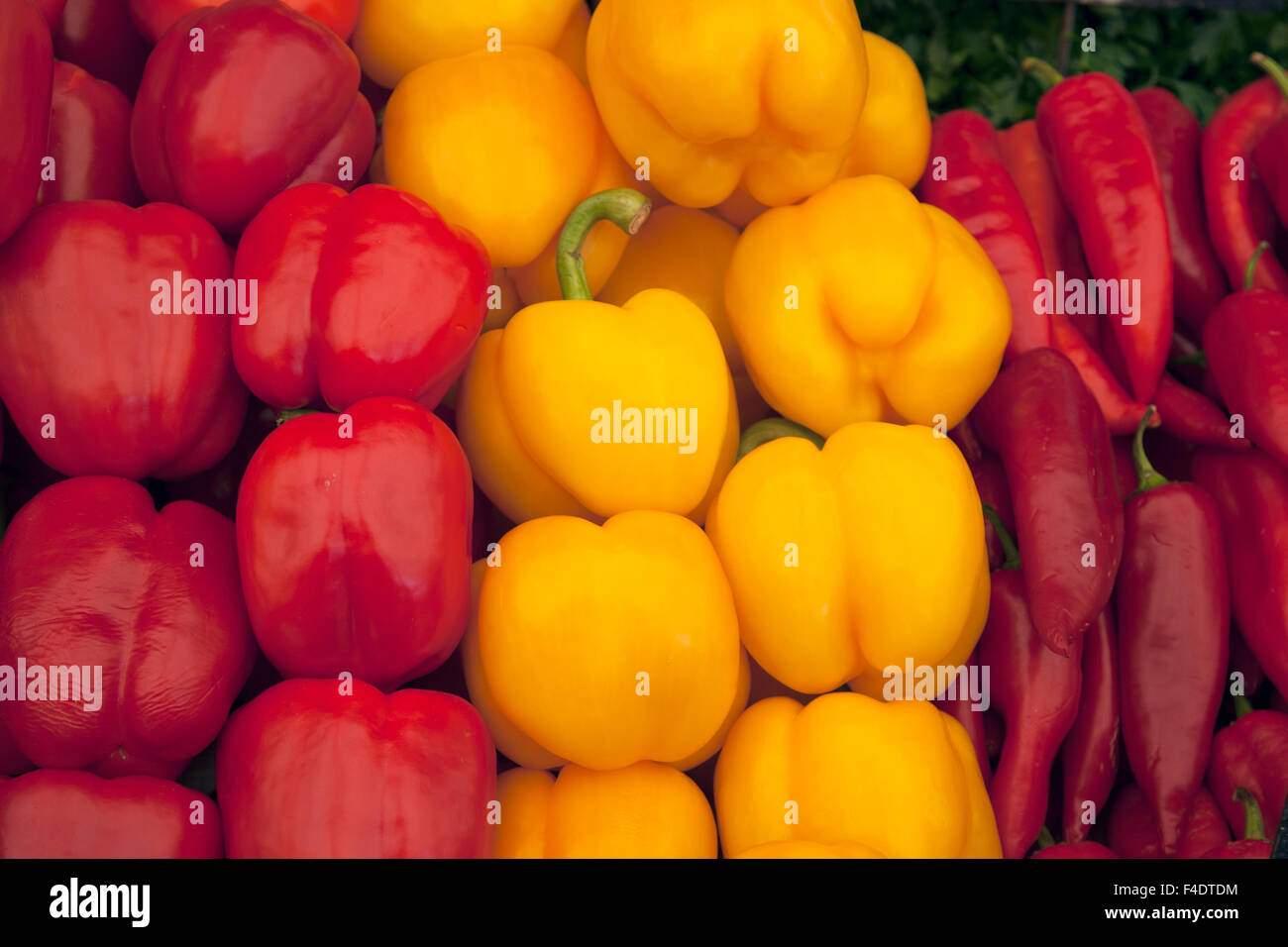 Red and Yellow Pepper Background on Market Stall Stock Photo - Alamy