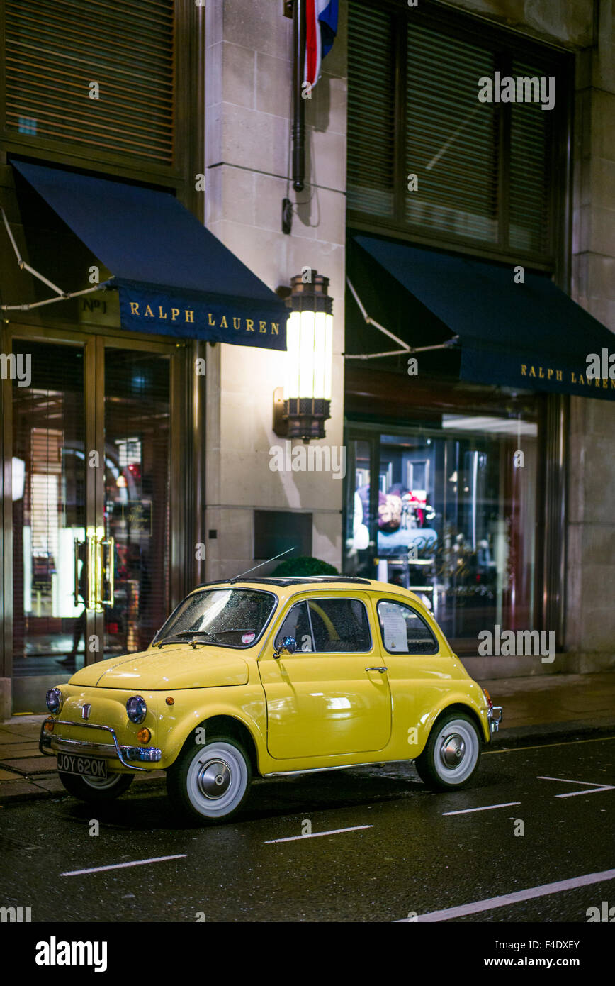 England, London, Mayfair, antique 1960s-era Fiat 500 car, evening Stock Photo