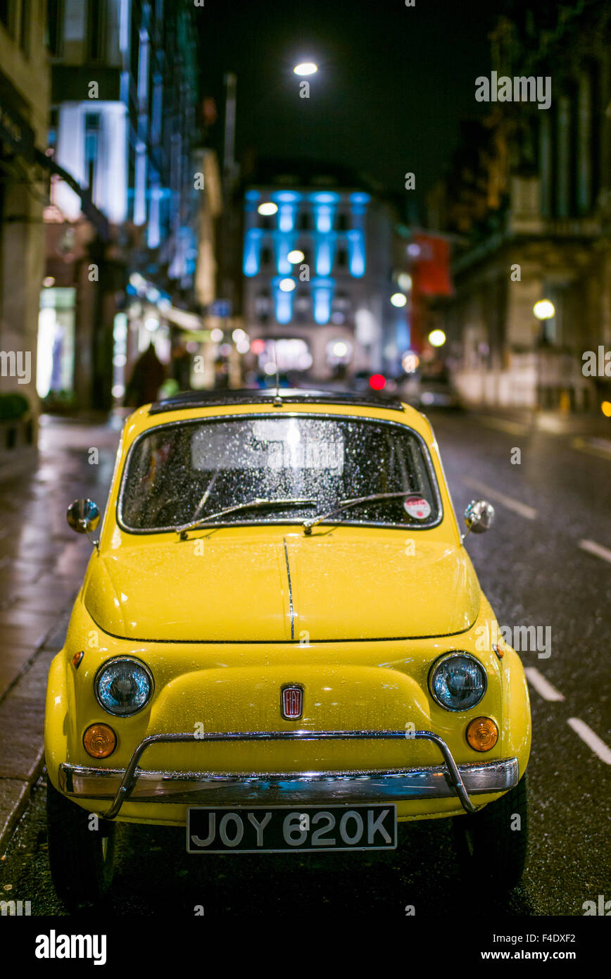 England, London, Mayfair, antique 1960s-era Fiat 500 car, evening Stock Photo