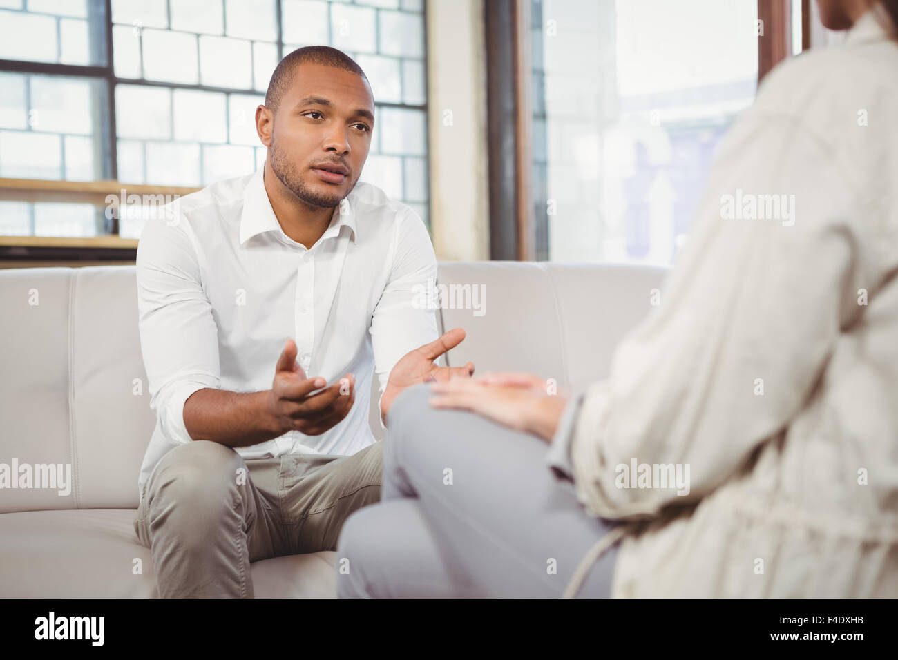 Depressed patient with counselor at clinic Stock Photo