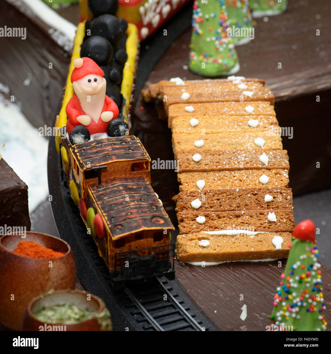 Marzipan Santa, in gingerbread village, riding train Stock Photo - Alamy