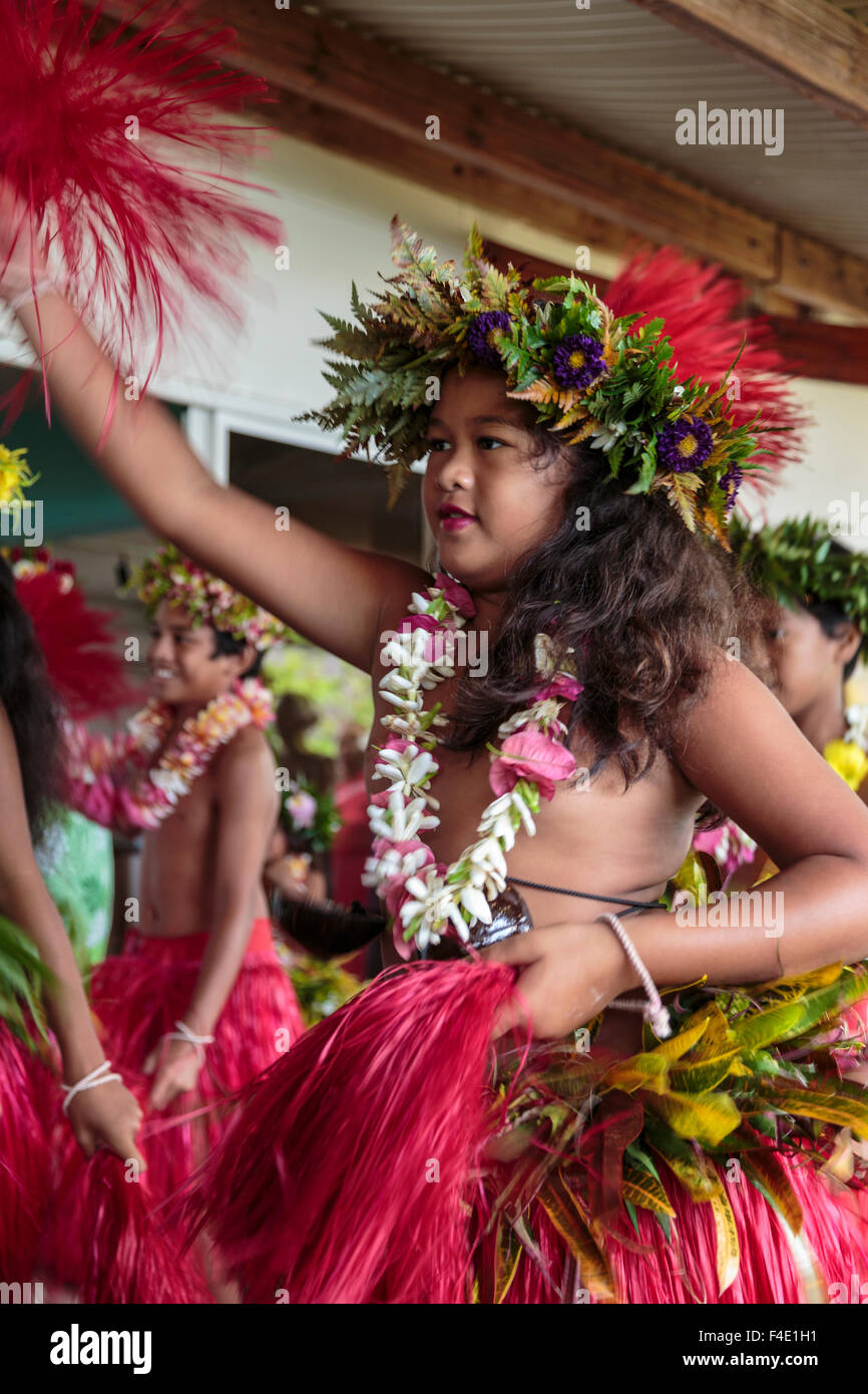 Pacific Ocean, French Polynesia, Society Islands, Raiatea. Young girl dancing in traditional French Polynesian clothing. Stock Photo
