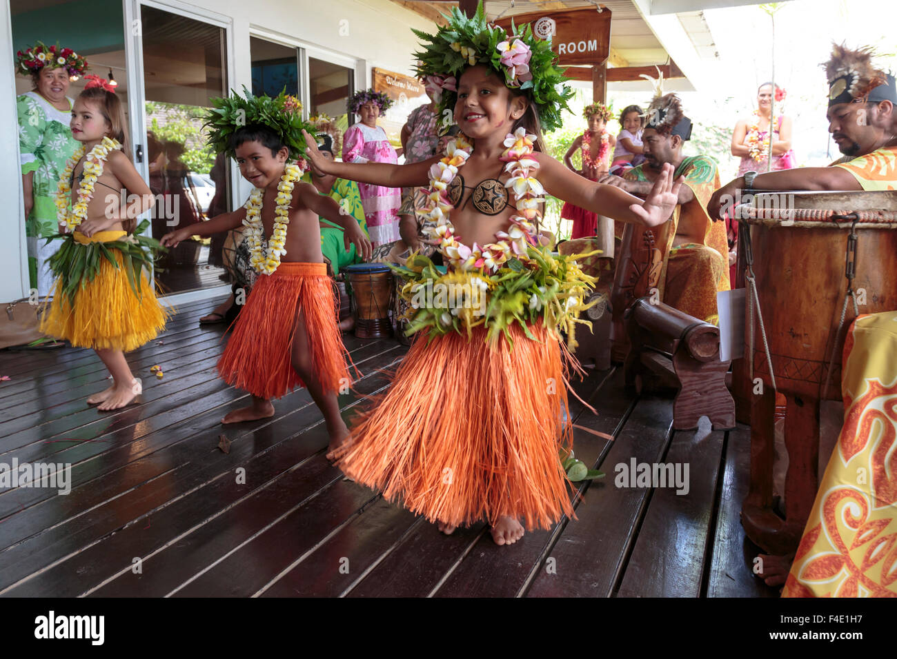 Pacific Ocean, French Polynesia, Society Islands, Raiatea. Children dancing in traditional French Polynesian clothing. Stock Photo