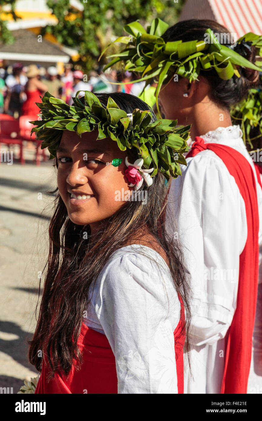 Pacific Ocean, French Polynesia, Society Islands, Huahine, Fare. Close-up portrait of young woman in traditional dress. Stock Photo
