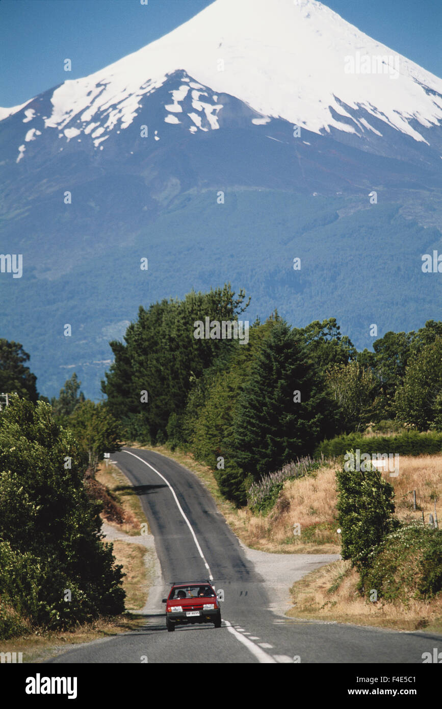 Chile, Llanquihue Lake, Baltos del Petrohue, Car passing through road. (Large format sizes available) Stock Photo