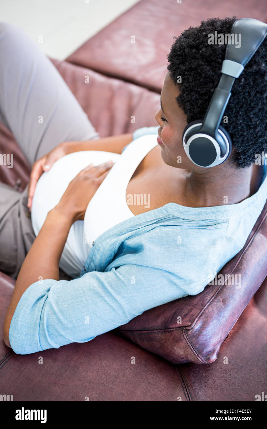 Happy pregnant woman listening to music Stock Photo - Alamy