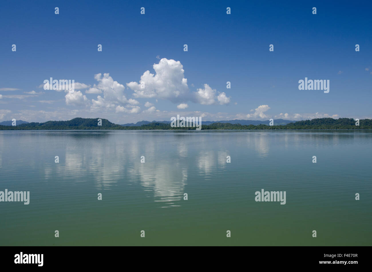 Guatemala, Department of Izabal, Rio Dulce River, El Golfete lake. Calm lake with cloud reflections. Stock Photo