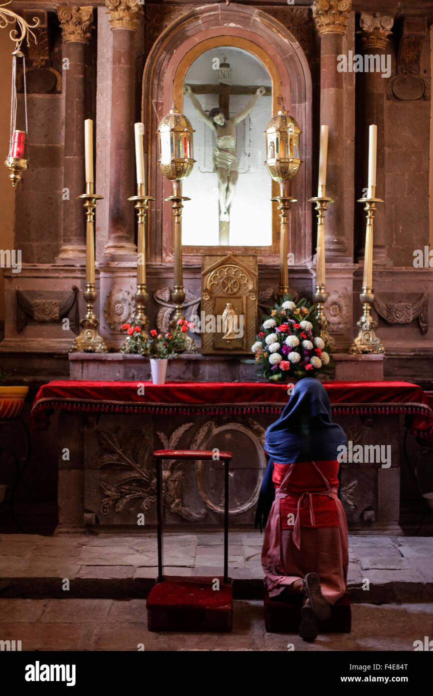 A supplicant praying, San Miguel de Allende, Mexico. Stock Photo