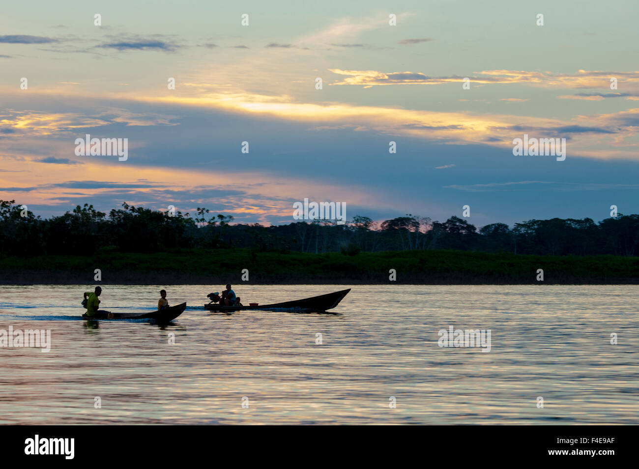 Canoes at sunset, Amazon basin, Peru Stock Photo - Alamy