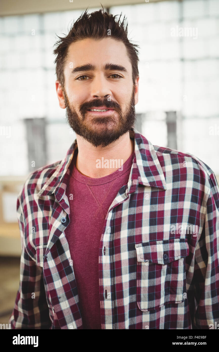 Portrait of happy businessman standing in office Stock Photo - Alamy
