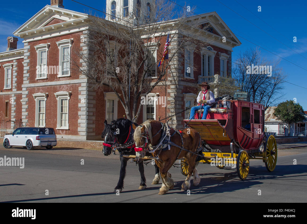 USA, Arizona, Tombstone. Stagecoach passes Tombstone Courthouse State