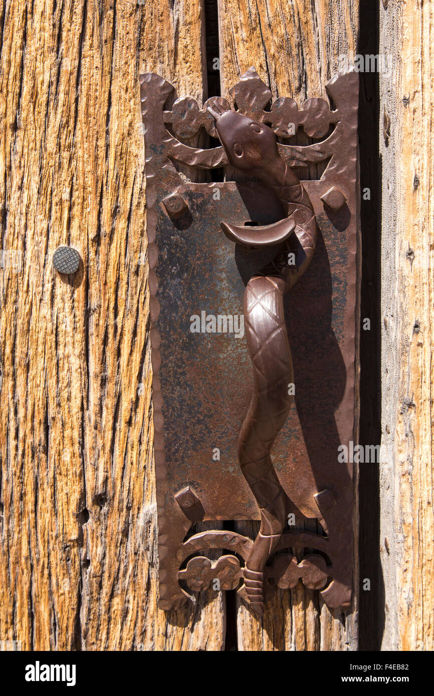 USA, Arizona, O'odham San Xavier Indian Reservation, San Xavier del Bac Mission. Bronze snake