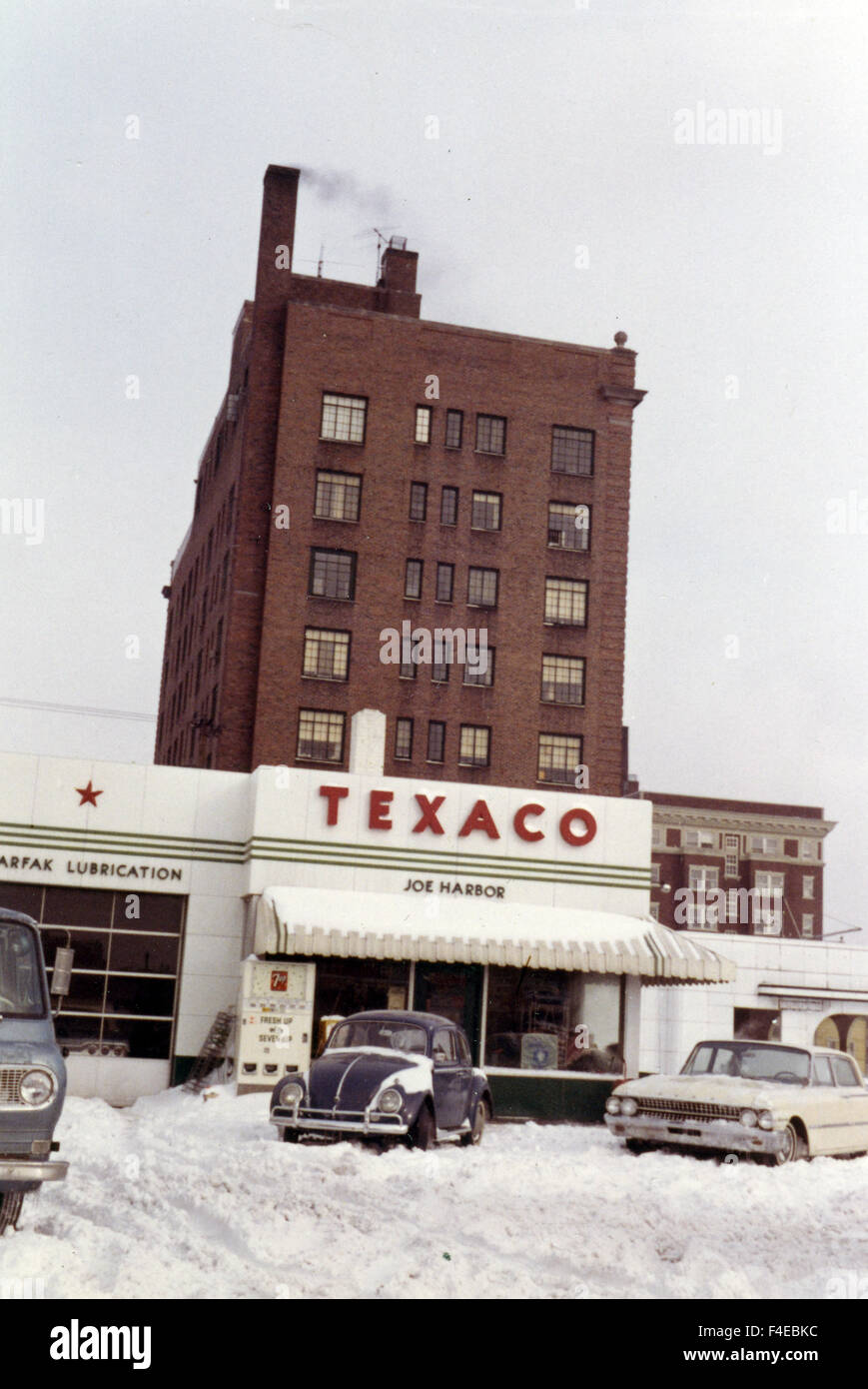 Texaco service station. VW car, covered in snow. traveling by Amtrak train around the United States in the early 1960s. travel Stock Photo