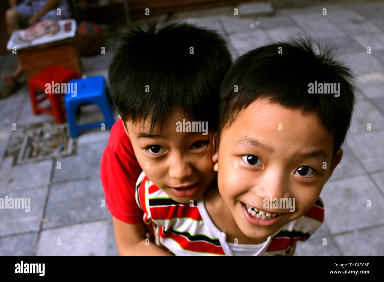Boys playing on the streets of Hanoi, Vietnam Stock Photo