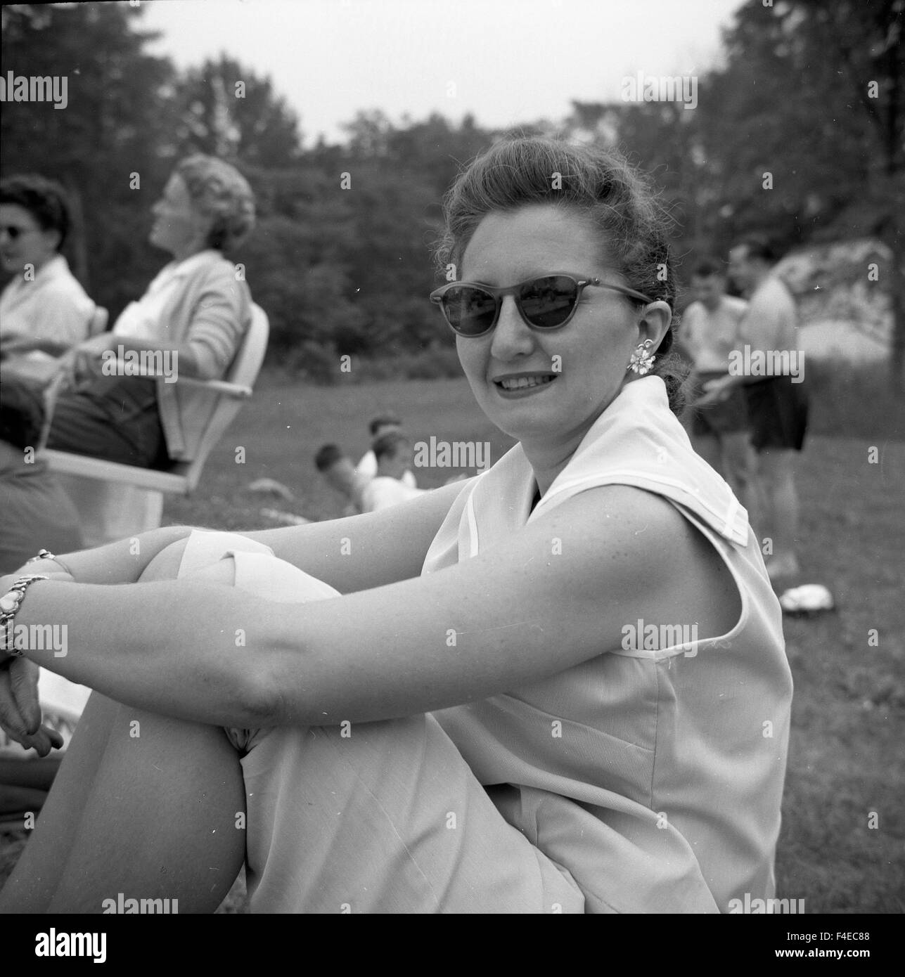 Middle aged woman looking at camera during a picnic Stock Photo