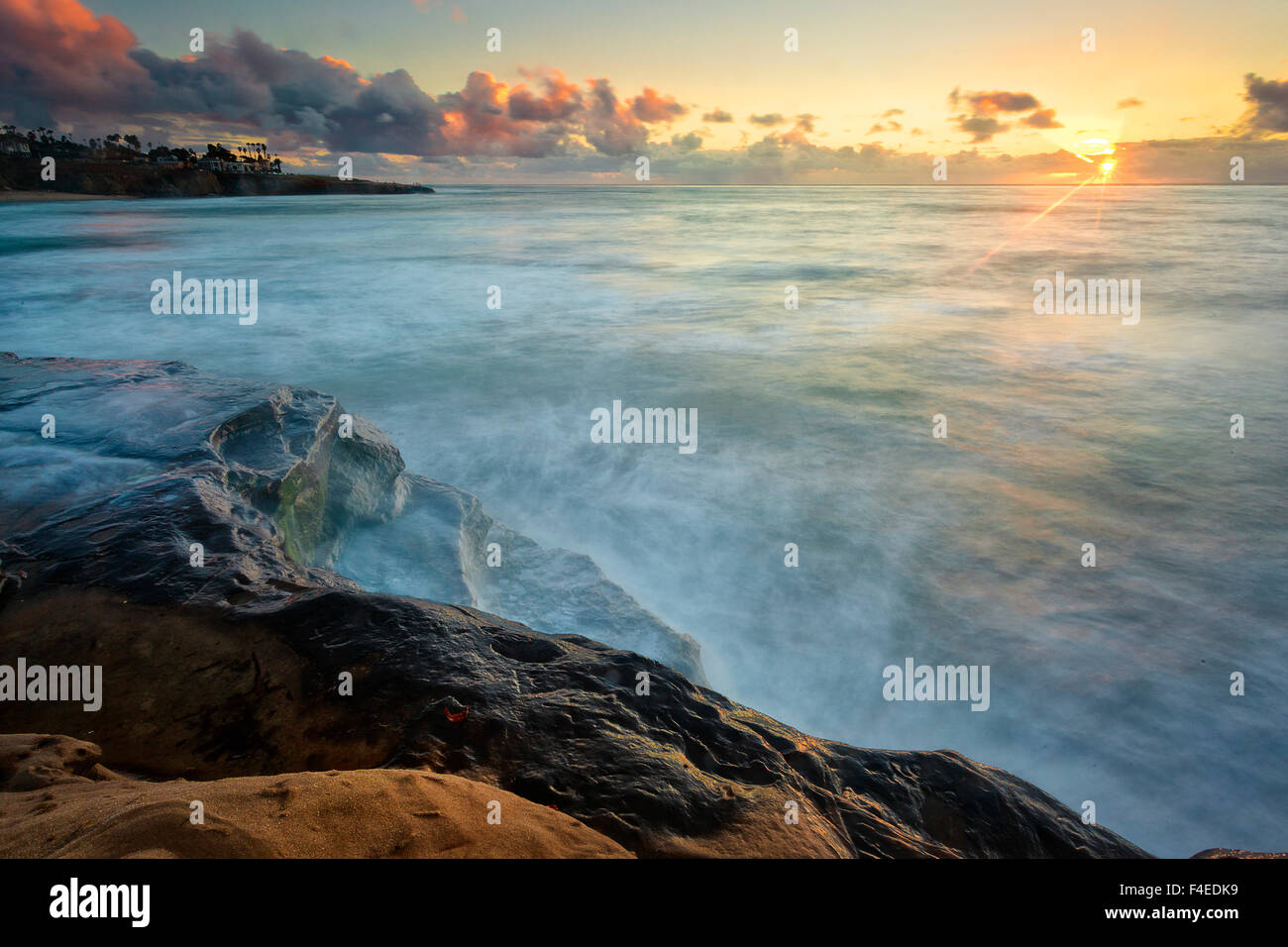 Sun ray illuminate the rocky cliffs of San Diego, CA Stock Photo