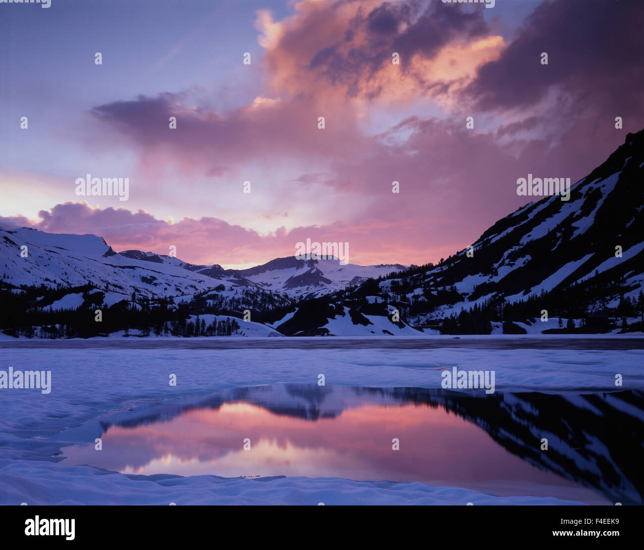 California, Sierra Nevada Mountains, Inyo National Forest, Sunset over a partially frozen Ellery