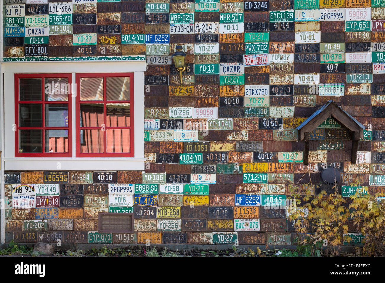 USA, Colorado, Crested Butte. Old license plates on outside building wall. Credit as Don