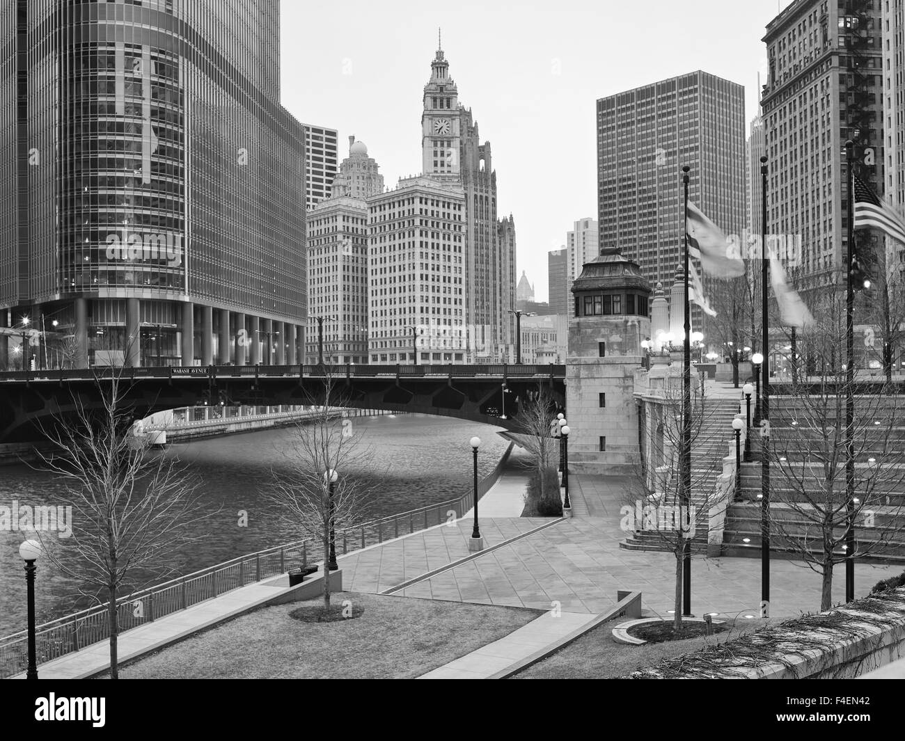 USA, Illinois, Chicago, River walk and Wabash Ave bridge over the river with Chicago Tribune building and Trump tower in the background. Chicago on a cloudy windy day. Stock Photo