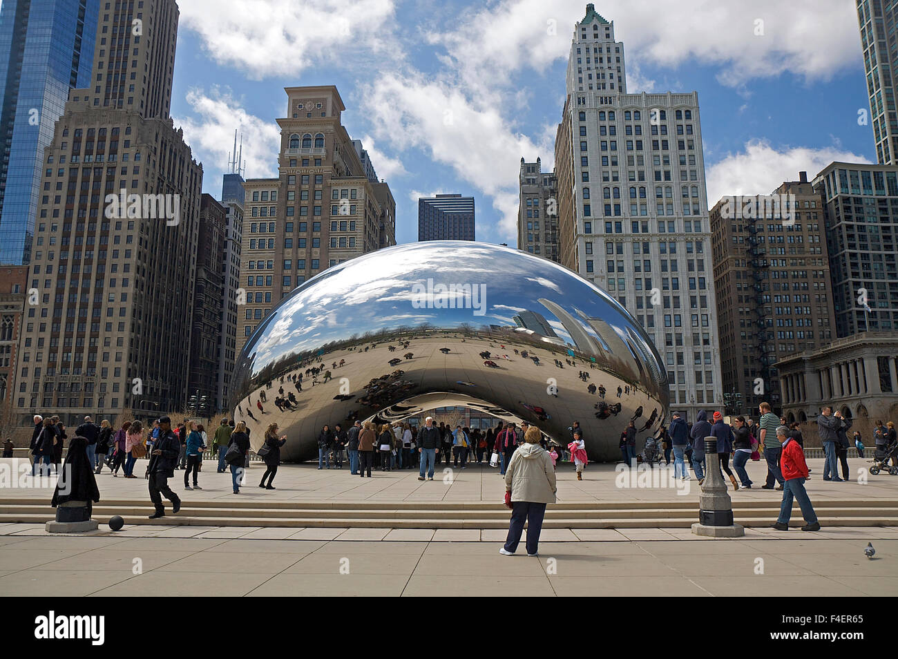 People gather around Chicago's 'Cloud Gate' sculpture, also known as