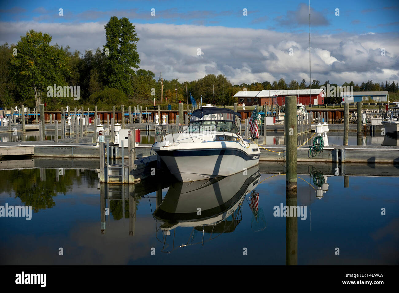 Michigan, Upper Peninsula. Escanaba Harbor. Small boat reflecting in