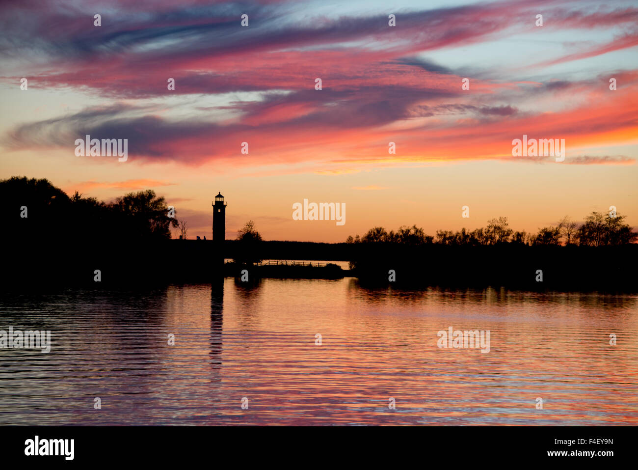 New York, Ogdensburg. Sunset over the Oswegatchie River junction with ...