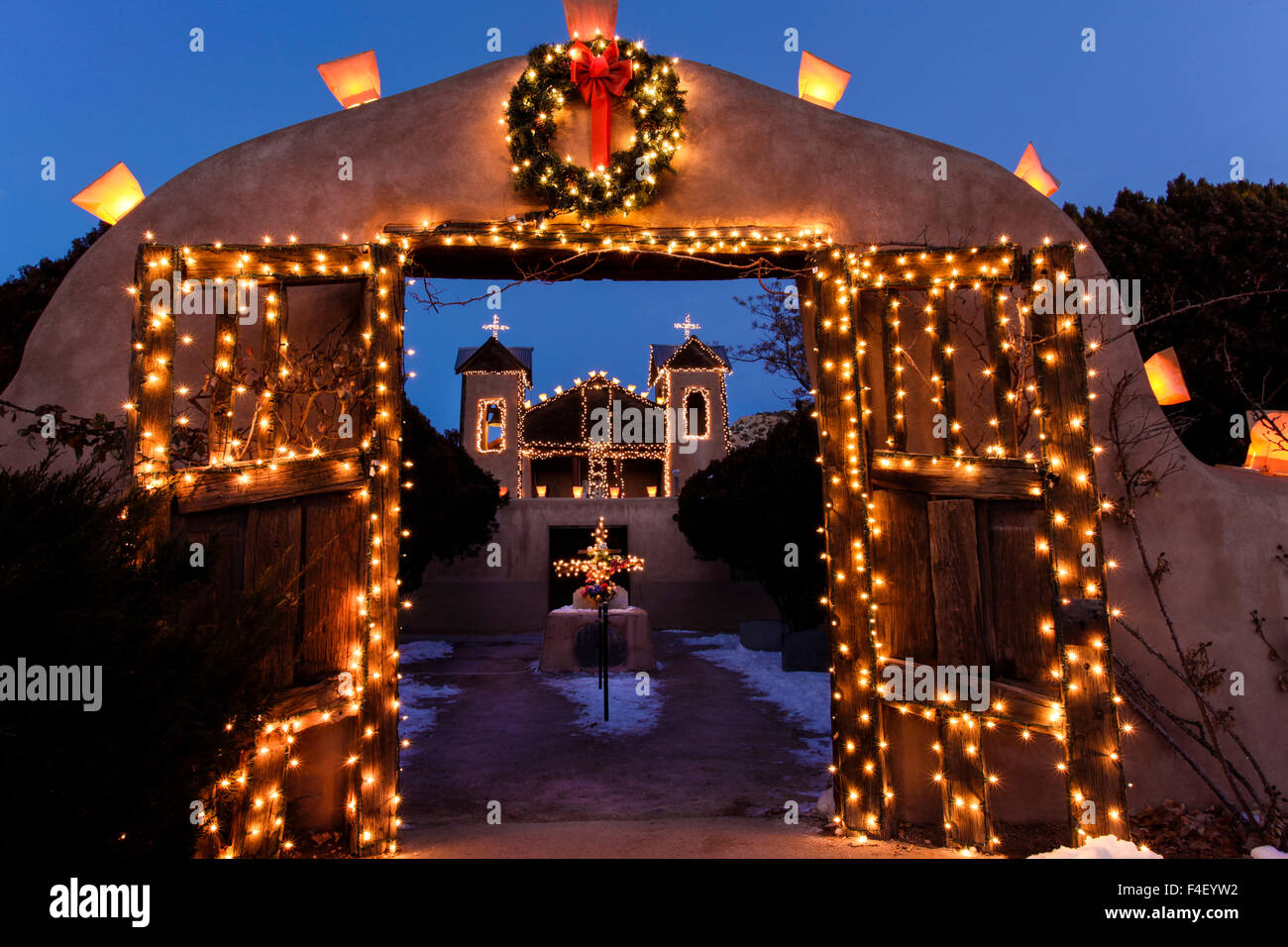 Chimayo, New Mexico, USA. Santurario de Chimayo lit up for Christmas. Stock Photo