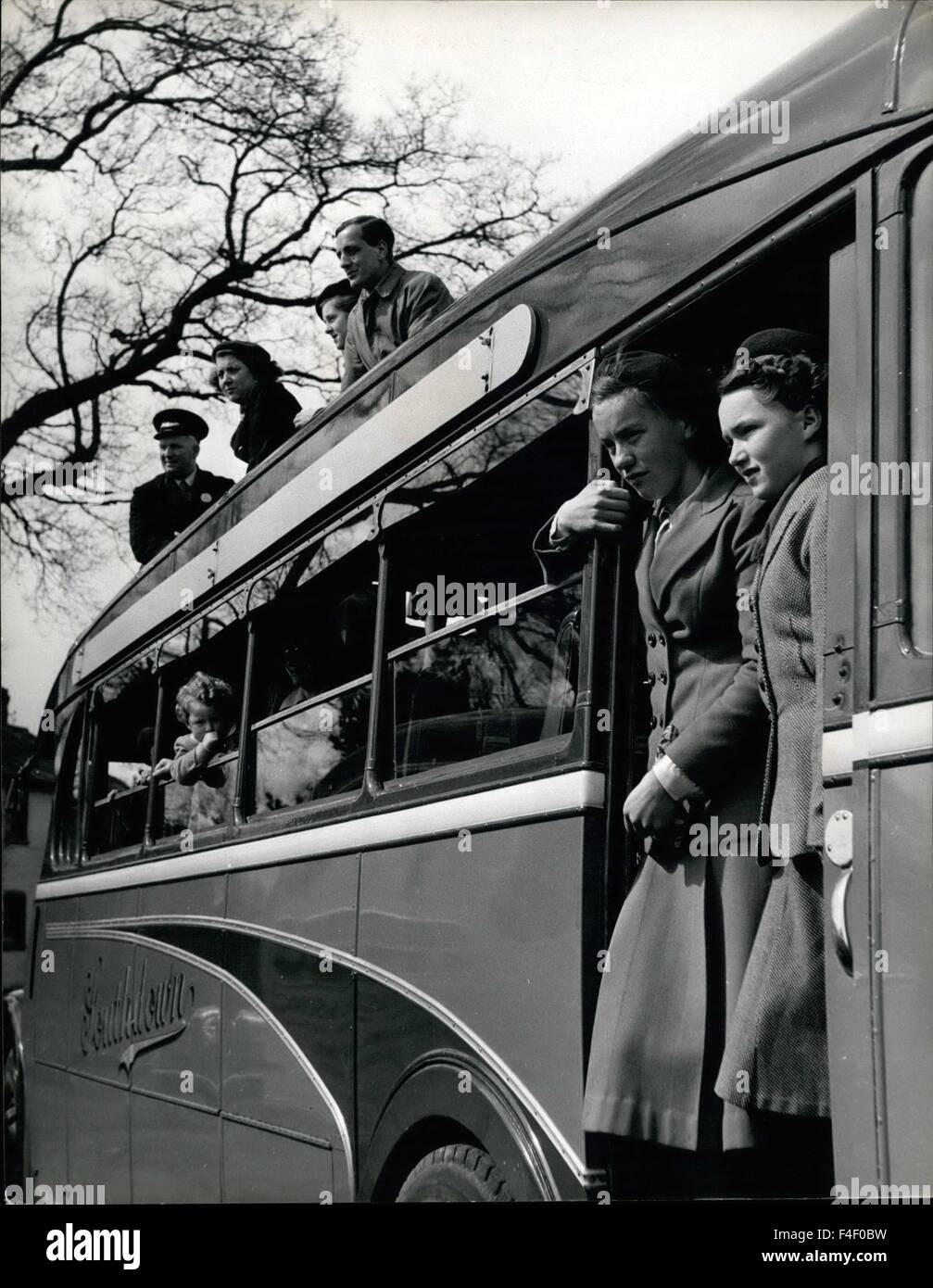 1964 - The Coach Is A Grandstand: Every year coaches filled with marble enthusiasts rumble up to The Greyhound at Tinsley Green. The coaches make useful grandstands from which to watch the game. The ''Toliey Men'' Of Tinsley Green:Once again the marble championshare practising hard for the annual National Championship to be played on Good Friday at Tinsley Green on the Surrey-Sussex border. Marbles is one of the world's oldest sports. It was played by the Roman Emperor Augustus. The Tinsley Green match dates back to the days of the Spanish Armada Threst when two local youths competed for the h Stock Photo