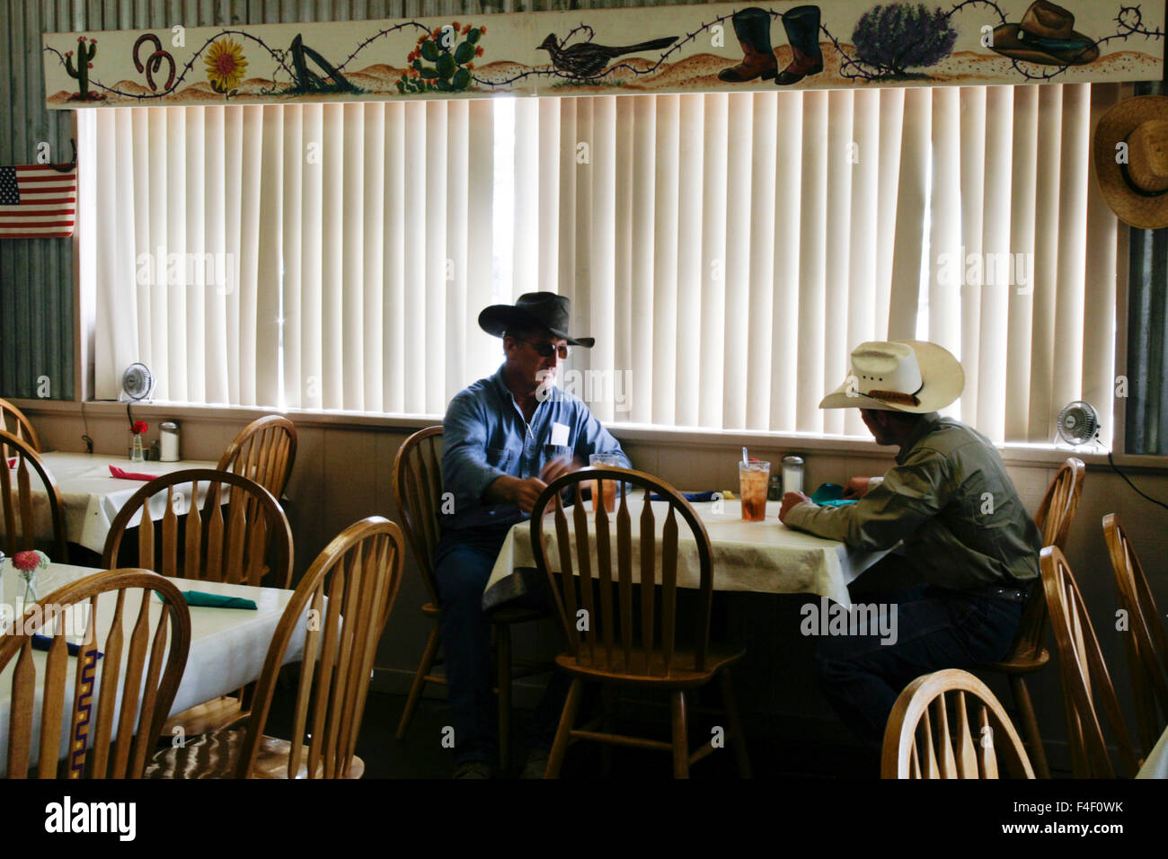 New men sitting down for a drink, Artesia, New Mexico, United States. Stock Photo