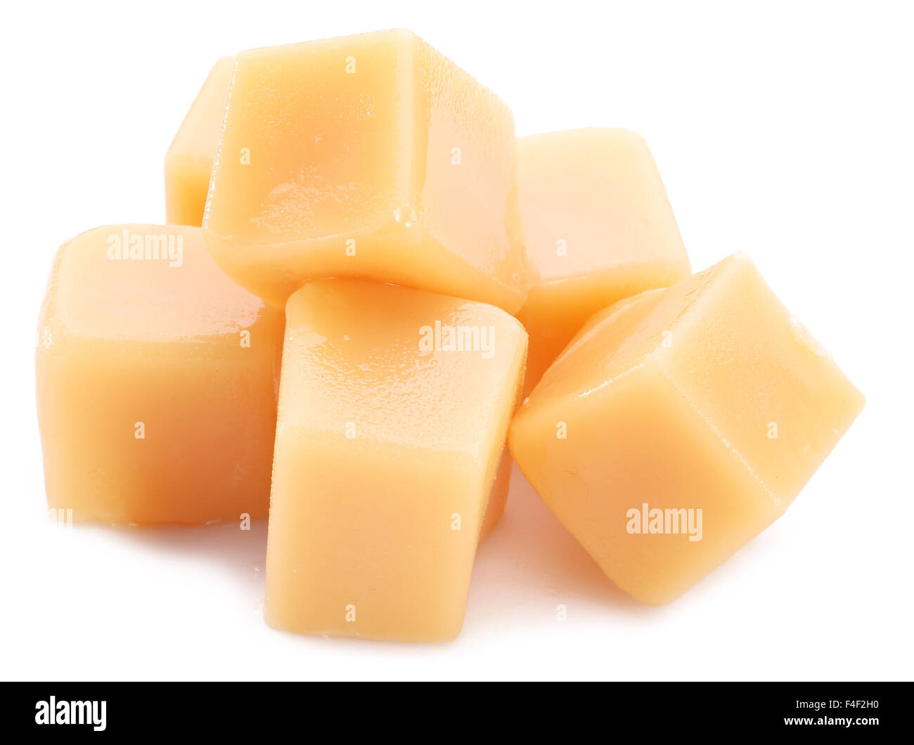 Sweet caramel candies on the white background. Stock Photo