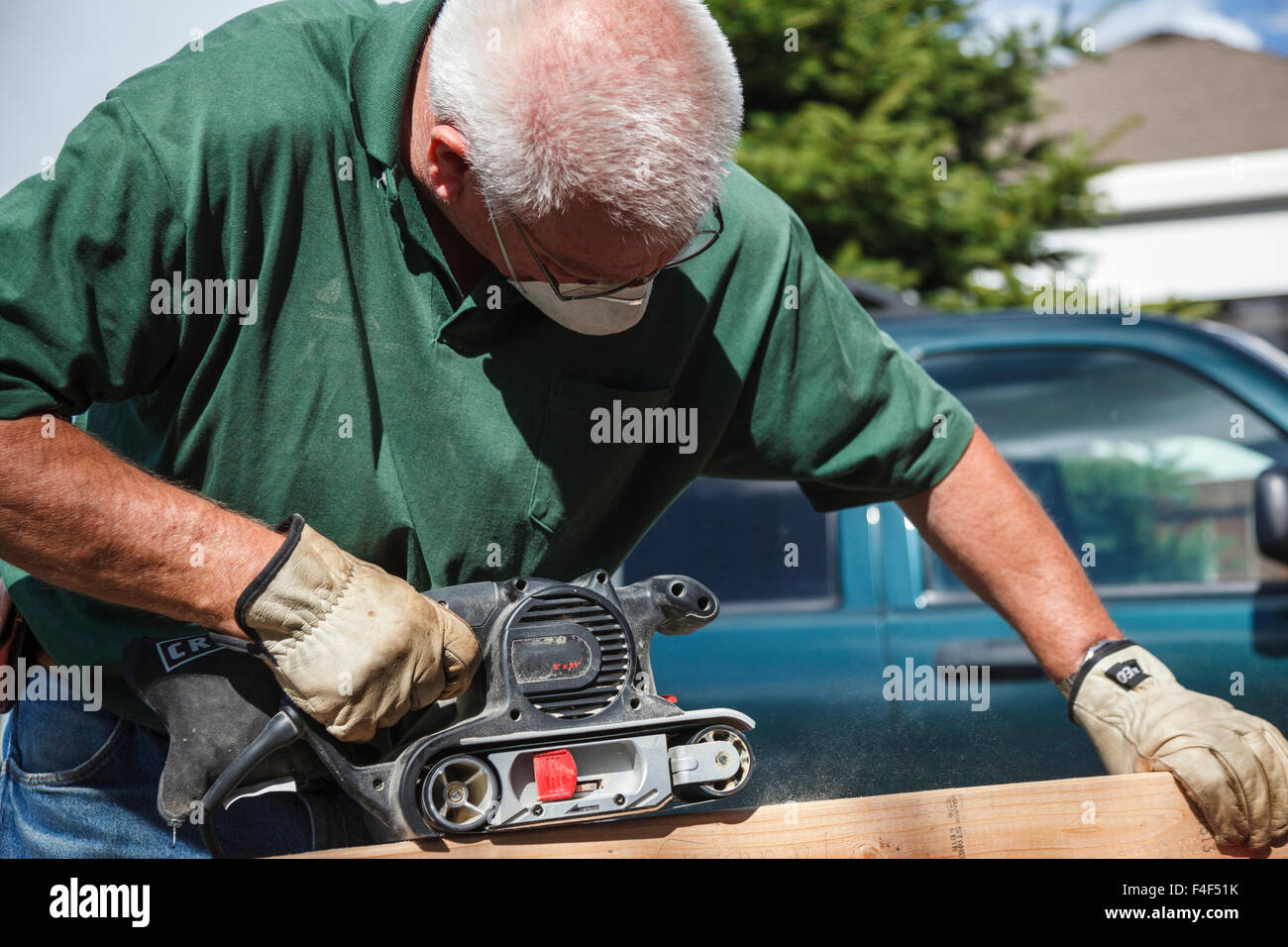 USA, Oregon, Keizer, man sanding wood work (MR Stock Photo Alamy