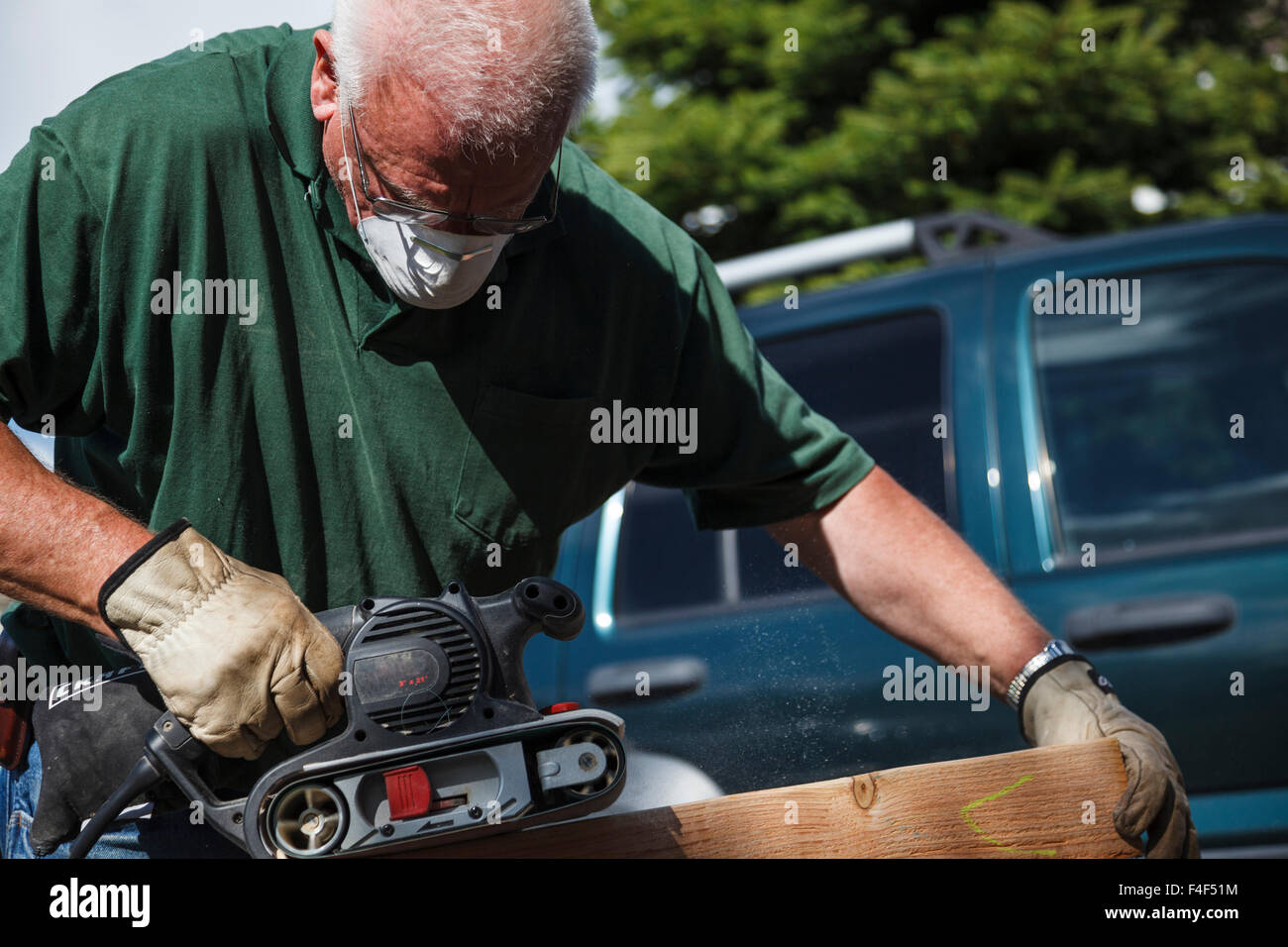 USA, Oregon, Keizer, man sanding wood work (MR Stock Photo Alamy