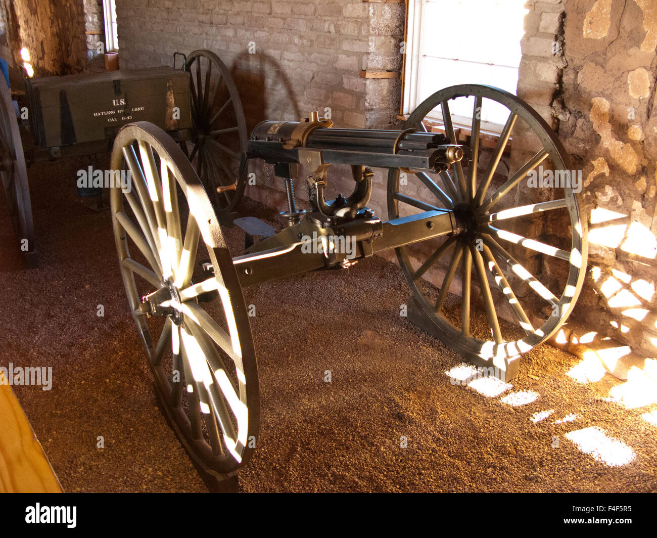 USA, Fort Davis National Historic Site, Texas, Wheeled Antique 45 Caliber Long Gatling Gun and Ammunition Cart. Stock Photo