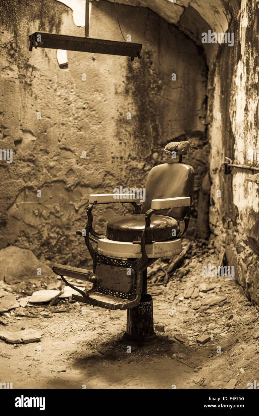 USA, Pennsylvania, Philadelphia, Eastern State Penitentiary, prison built in 1829, cell with barber's chair Stock Photo