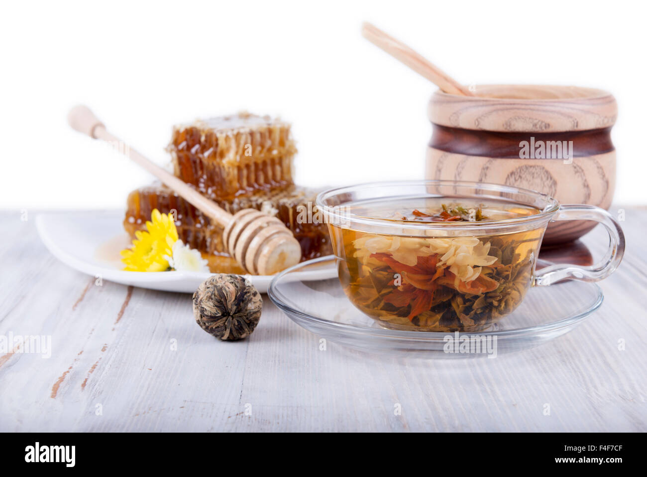 composition of green tea and honey on a white background Stock Photo