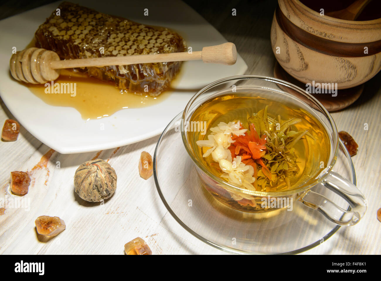 composition of green tea and honey on a white background Stock Photo