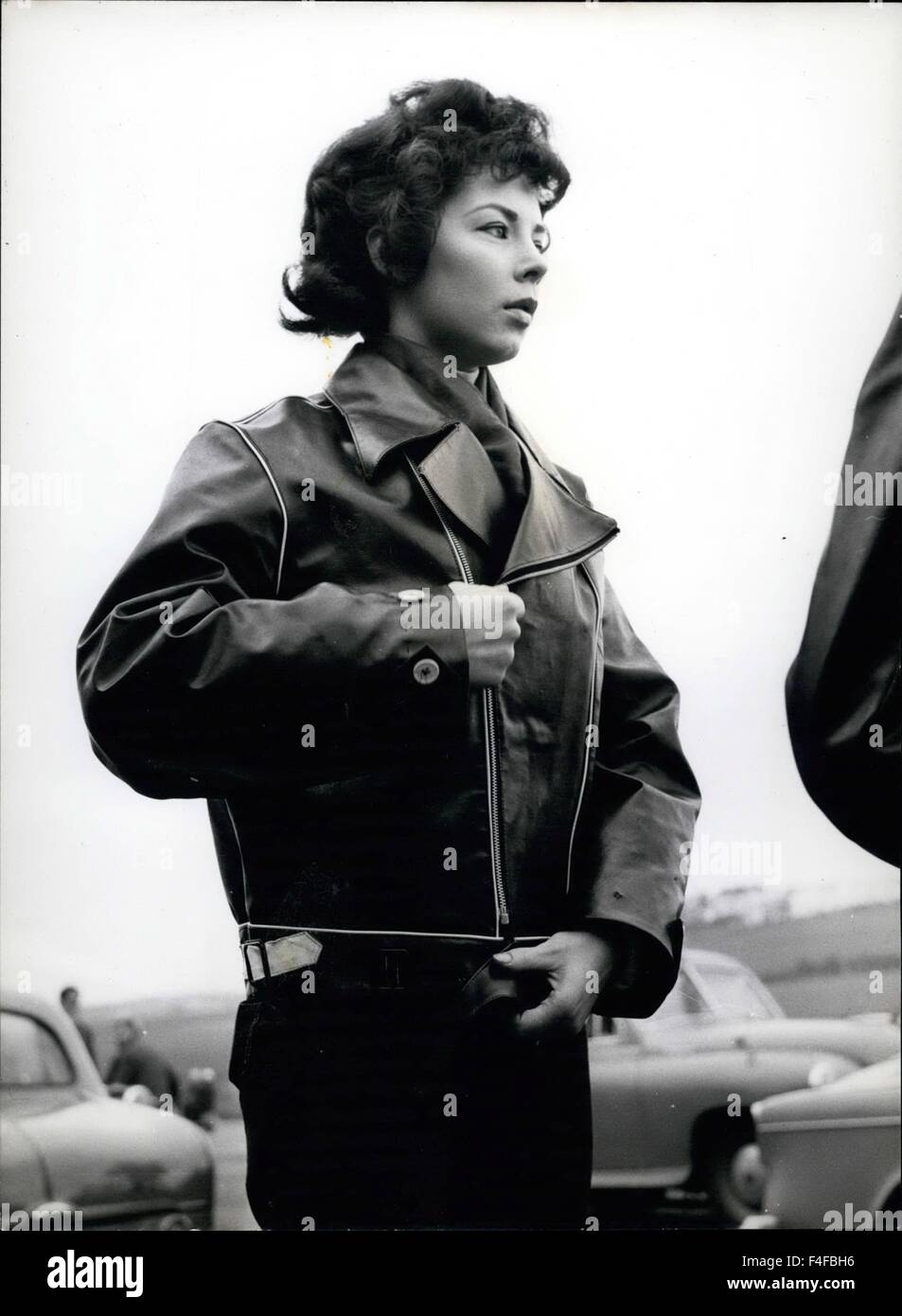 Feb. 24, 1963 - Keep out the cold: Ivy Holmes, 16, of Maidstone zippers up her jacket against brisk air-flow of racing motorcycles. © Keystone Pictures USA/ZUMAPRESS.com/Alamy Live News Stock Photo