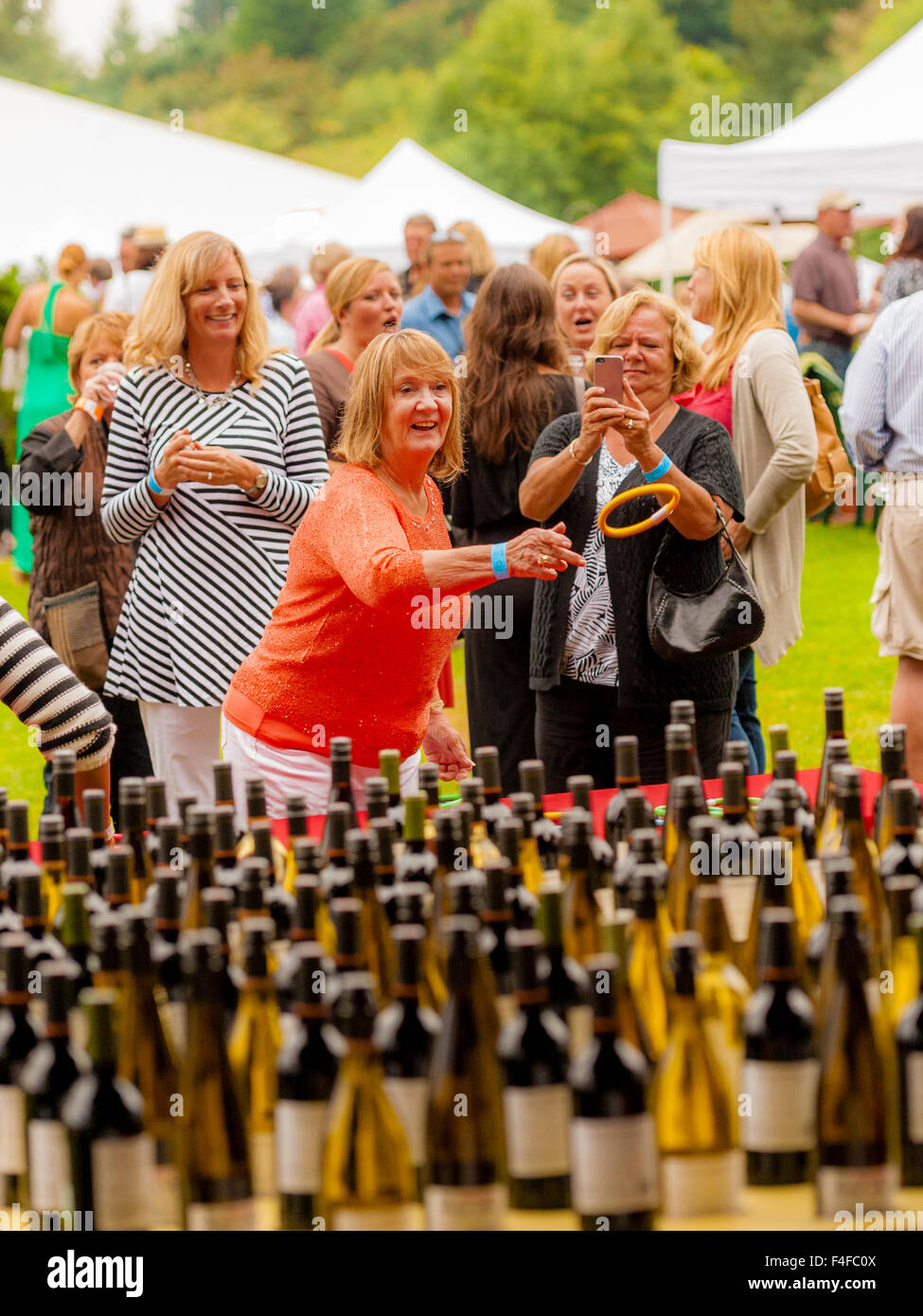 USA, Washington, Seattle, Woodinville. Ring toss over the necks of wine bottles is a popular