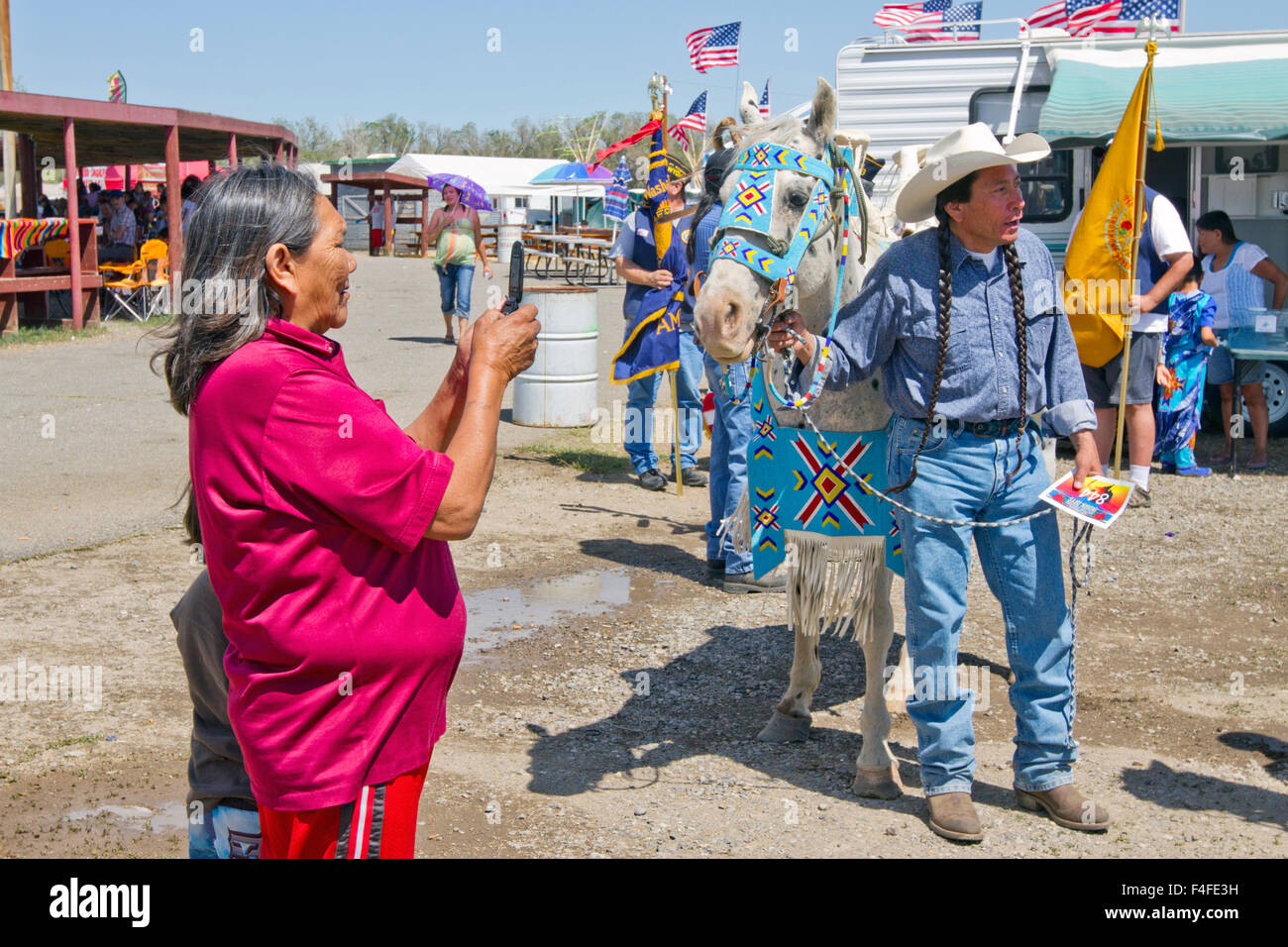 USA, Wyoming, Fort Washakie. Women taking pictures of a participants in