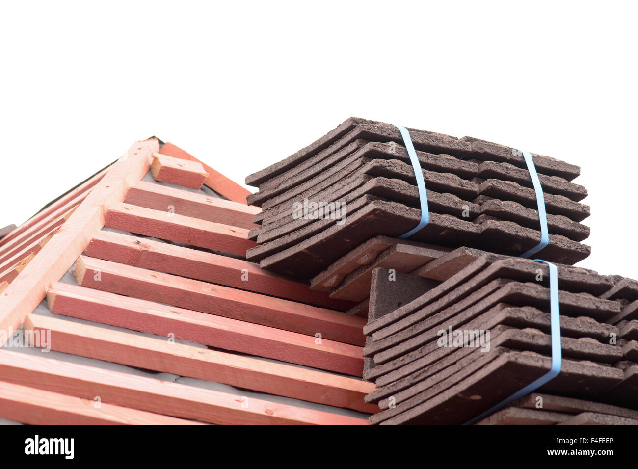 Stacks of roof tiles on roof ready for fitting to Victorian style home