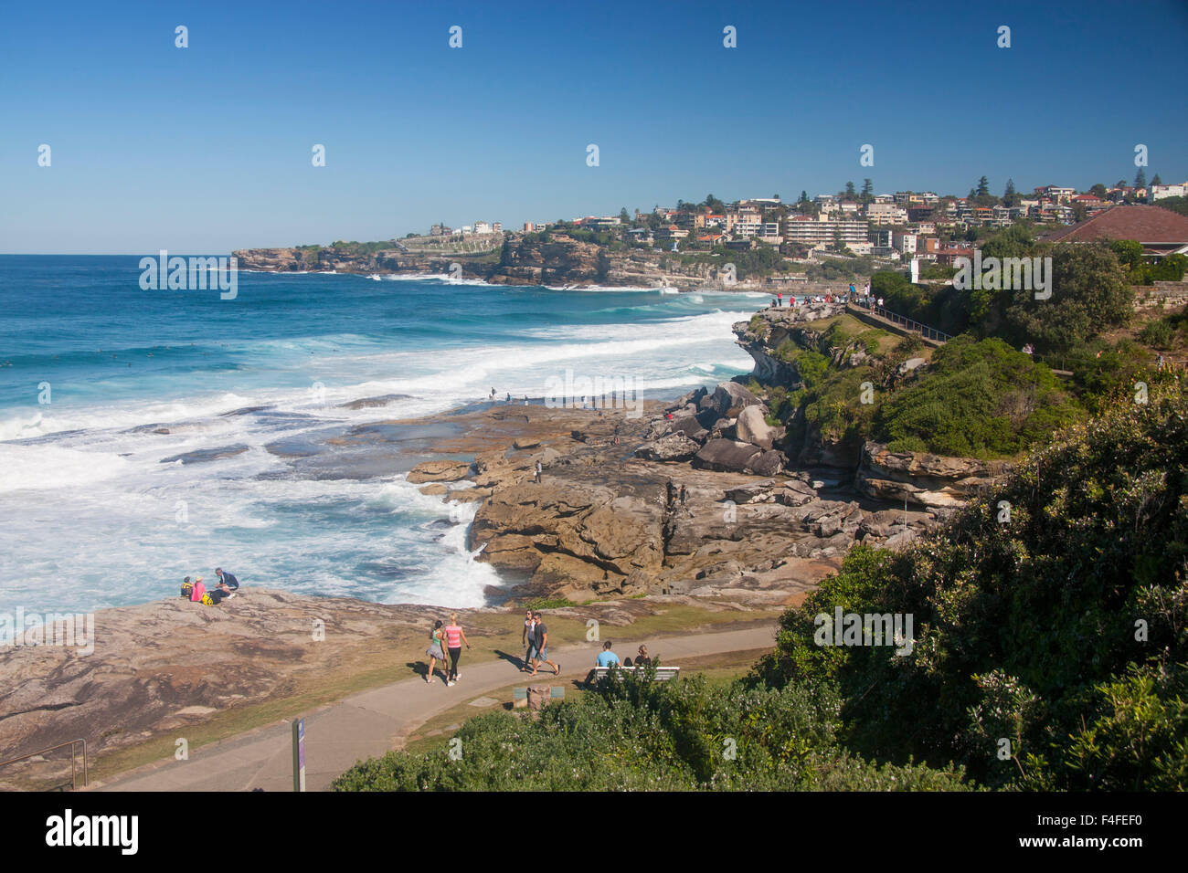 Tamarama beach bay and Bondi to Coogee coastal walk footpath with people walking on trail Sydney New South Wales NSW Australia Stock Photo