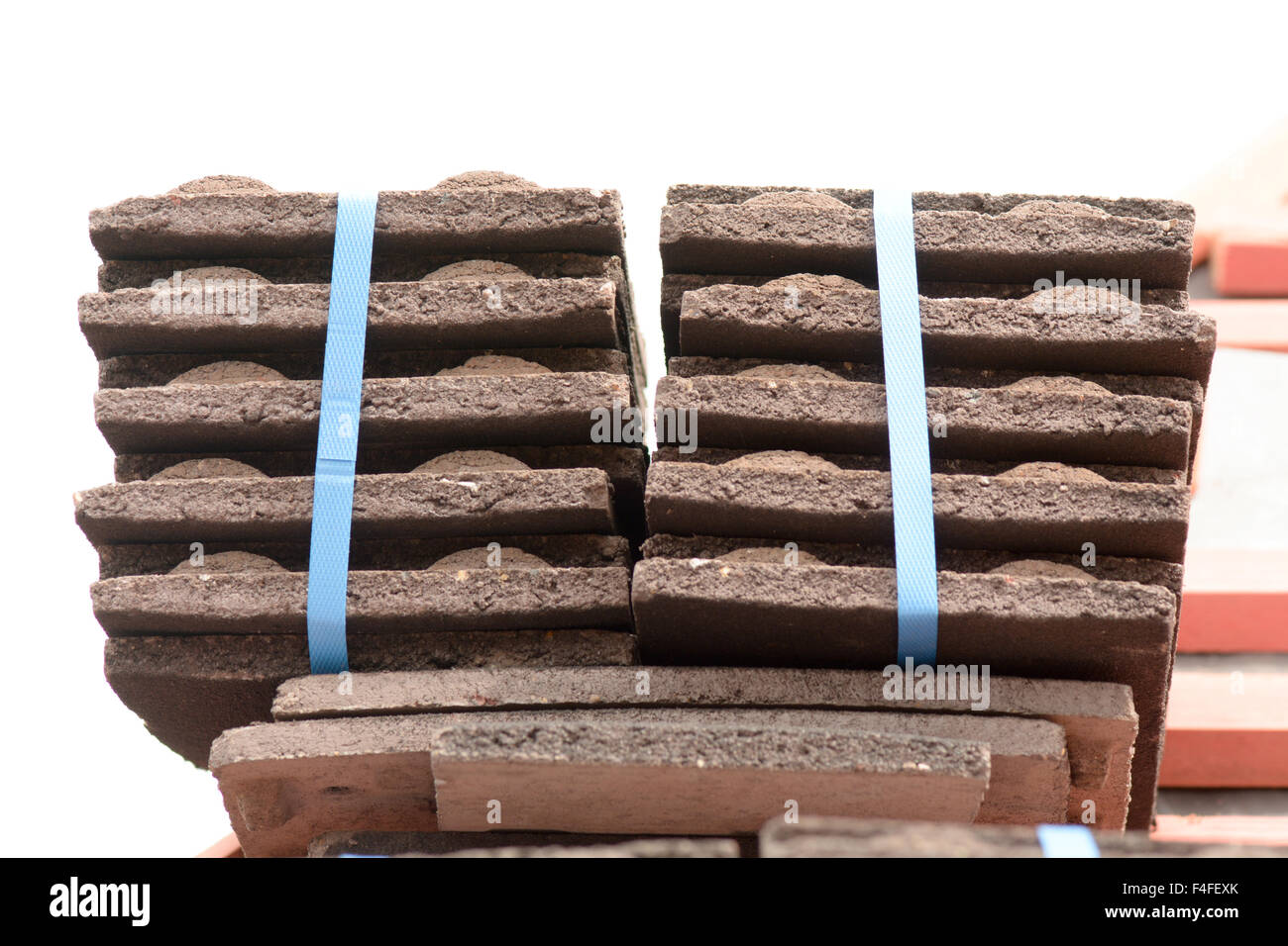 Stacks of roof tiles on roof ready for fitting to Victorian style home