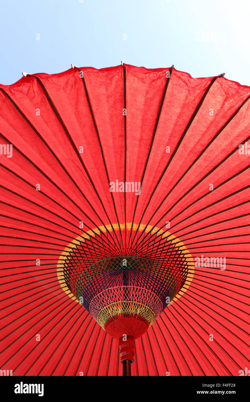Japanese red umbrella against the blue sky Stock Photo